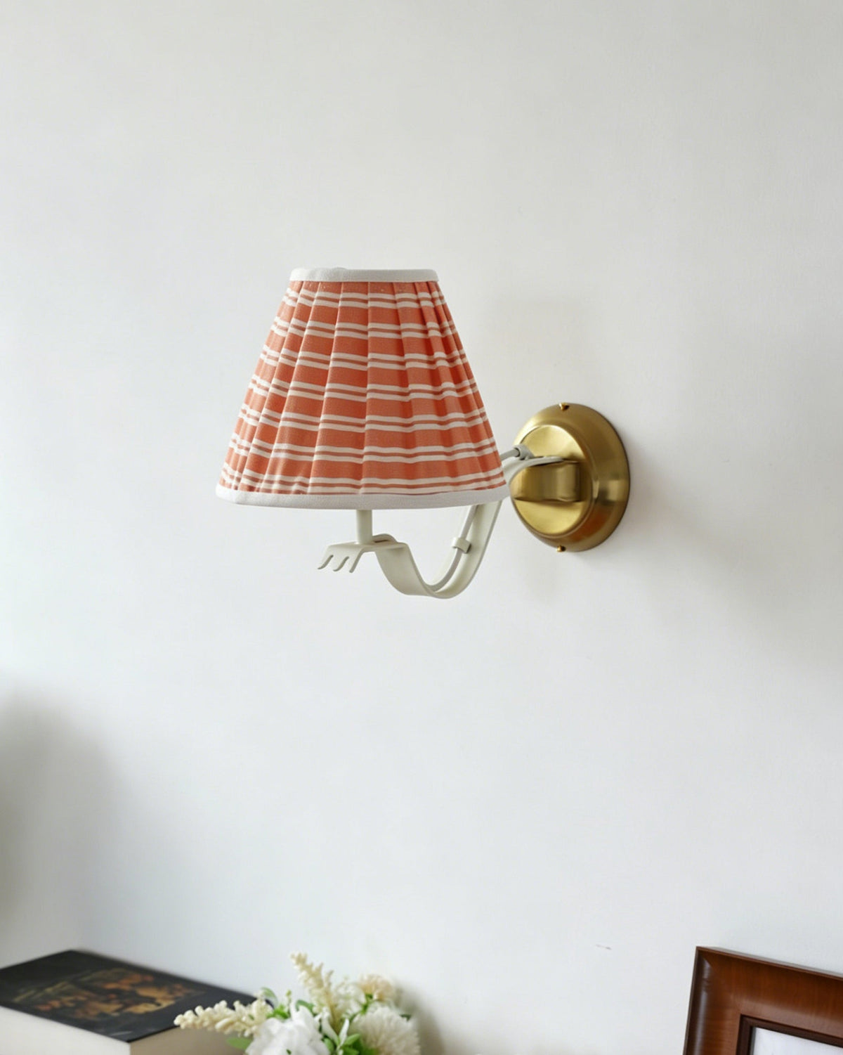 Penelope sconce installed in a modern hallway.