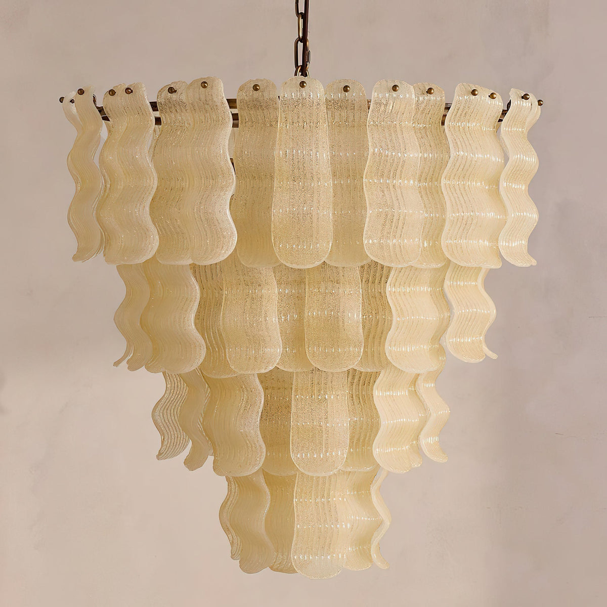 The chandelier viewed from below, showing the arrangement of bulbs and glass.