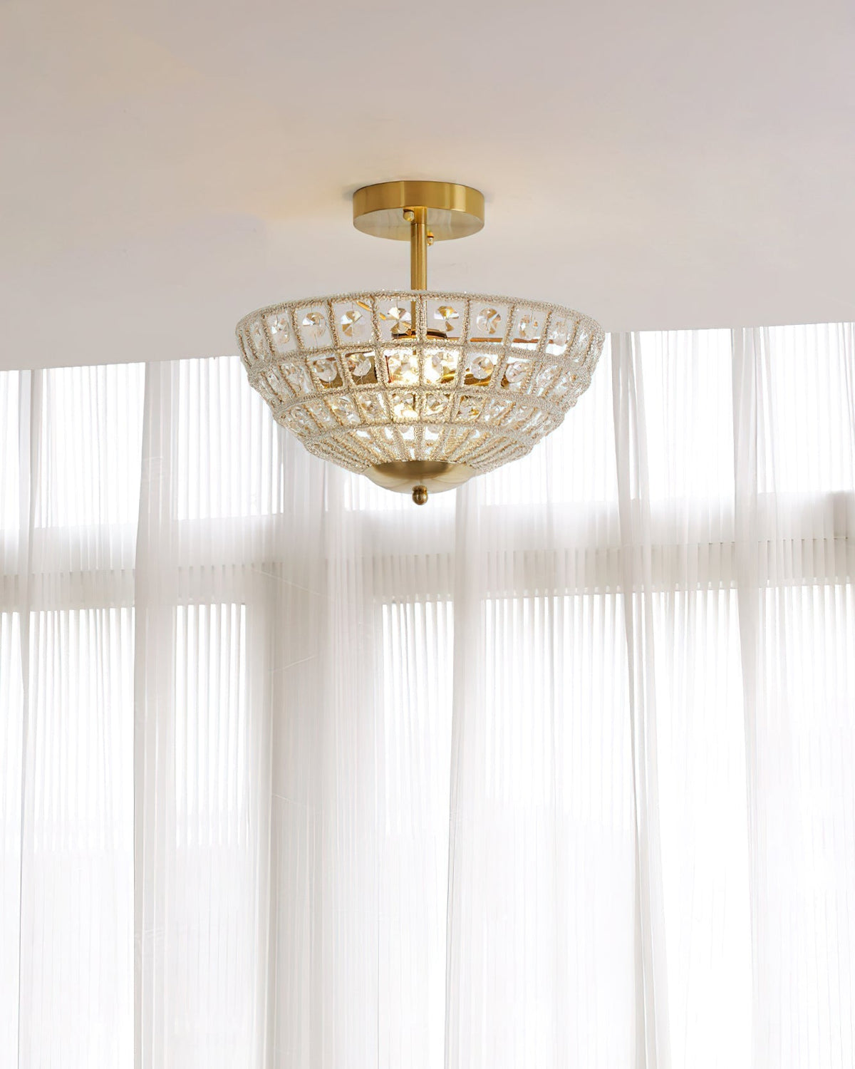 Lifestyle view of the gold crystal ceiling light in a modern interior.