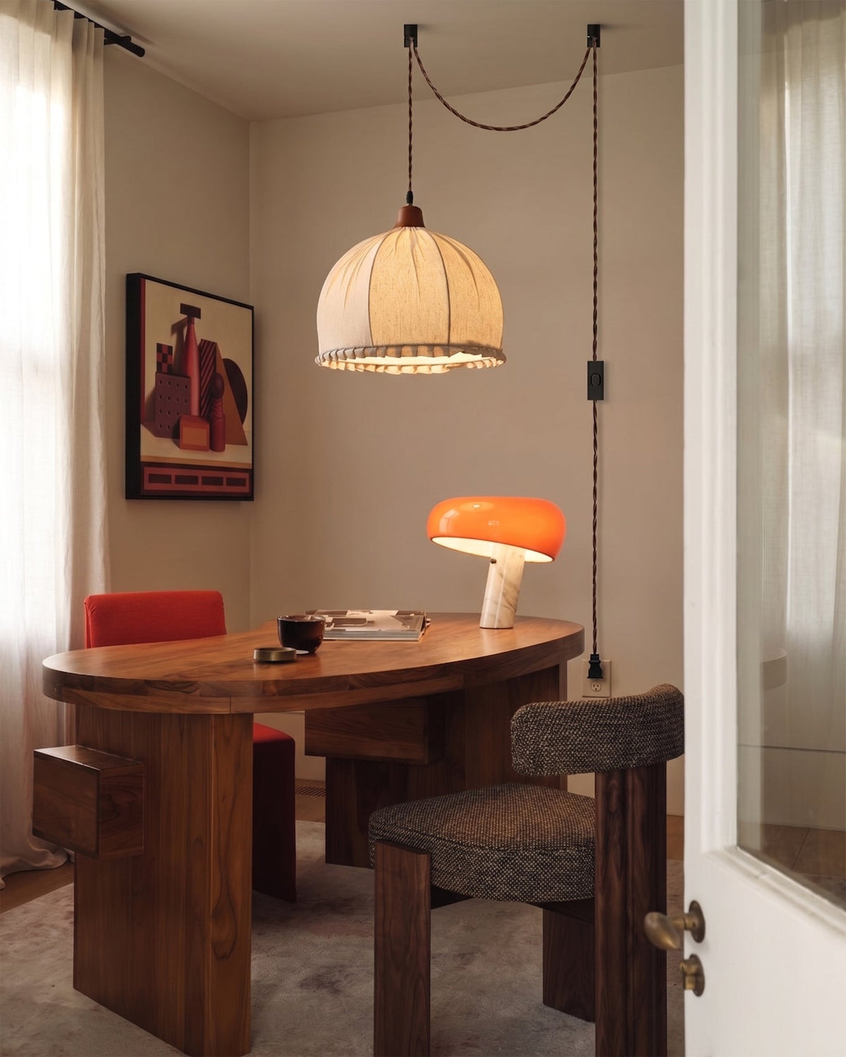 The extra-long 450cm cord of the Dippa Swag Light draped gracefully from a ceiling hook.
