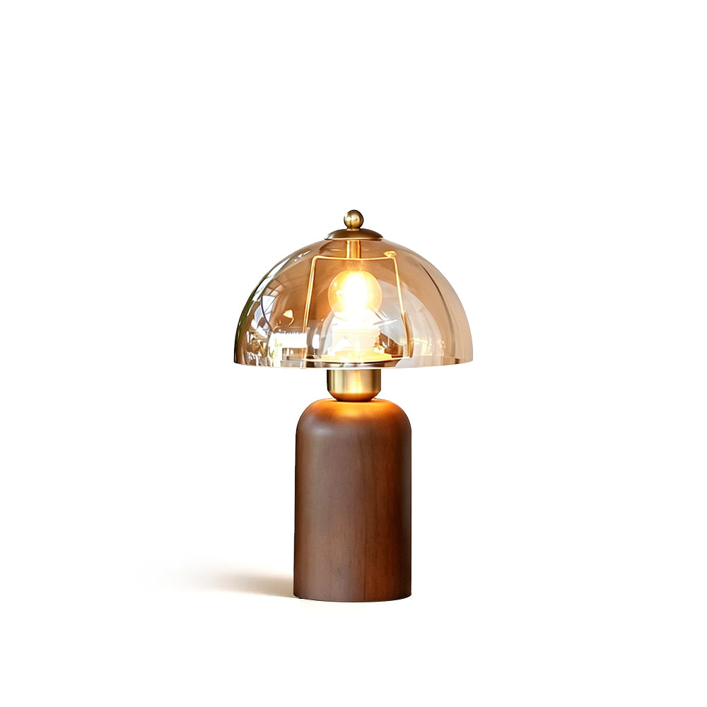 Disko Table Lamp with walnut base and amber glass dome on a neutral background.