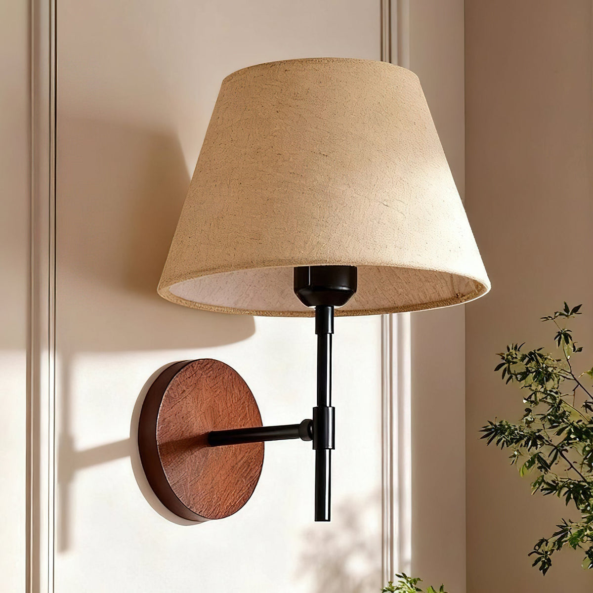 Close-up of the Dodie Wall Light's fabric shade texture and wooden details.