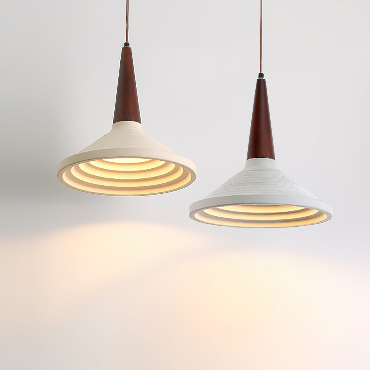 The Doherty Pendant Light shown against a dark, textured wall.