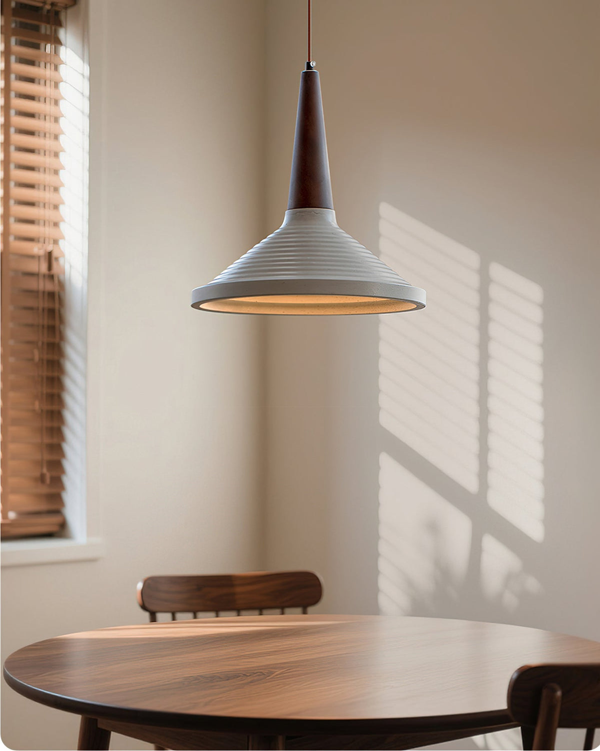 Doherty Pendant Light in grey cement finish.