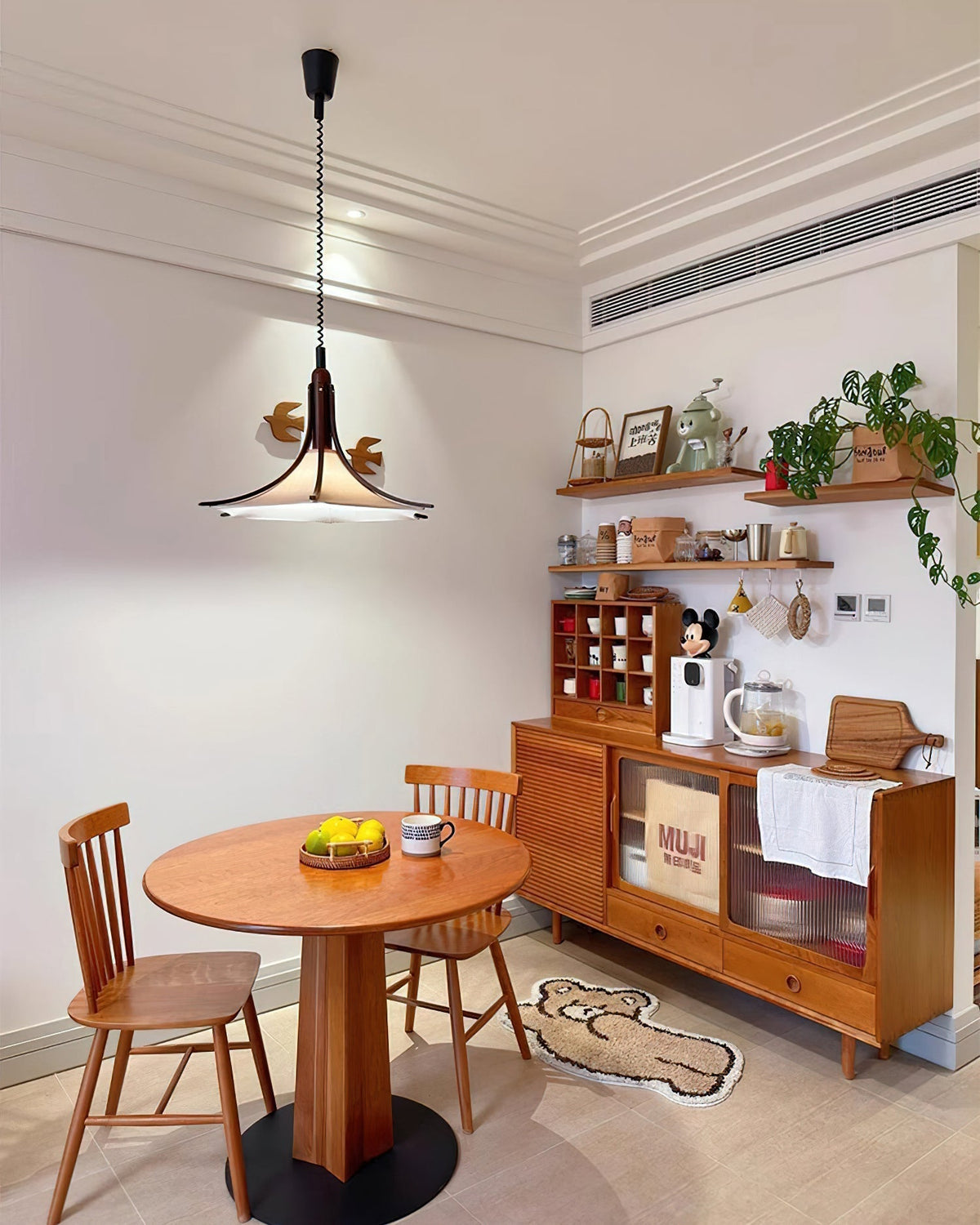 Domus Pendant Light against a neutral wall to showcase its design.