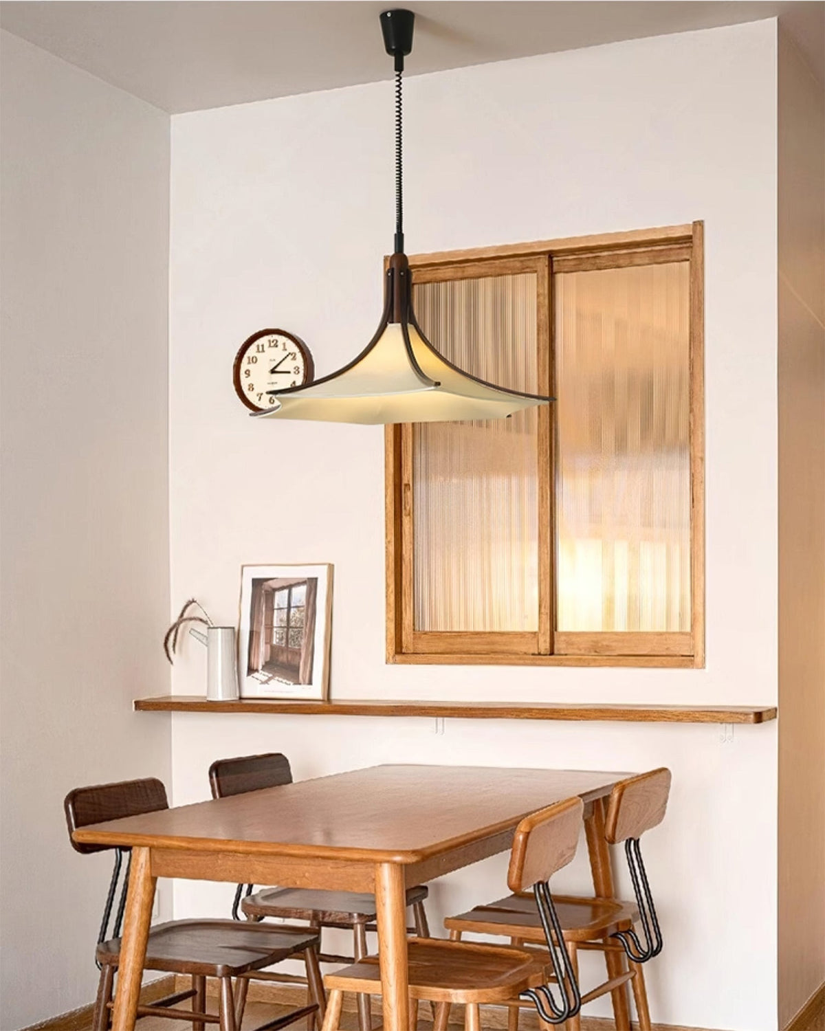 The Domus Pendant Light illuminated, casting a warm and inviting glow.