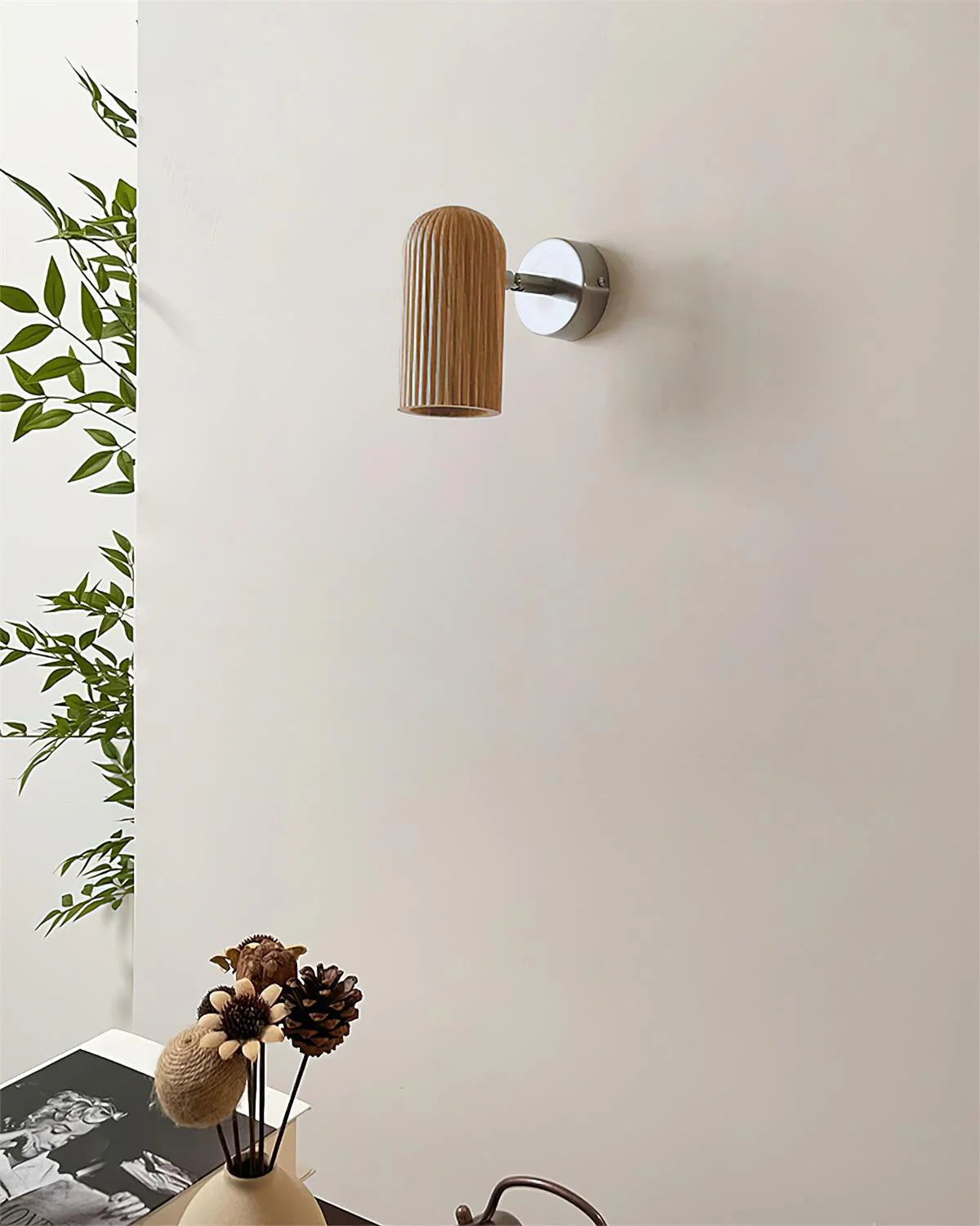 Donovan Wall Lamp in a natural wood color finish.