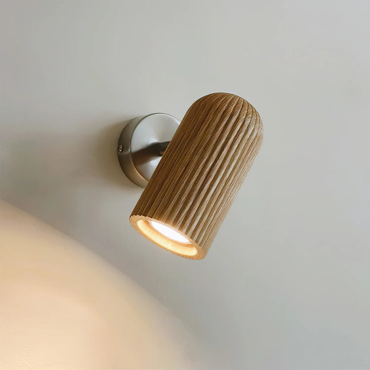 Close-up of the Donovan Wall Lamp showing the wood and metal details.
