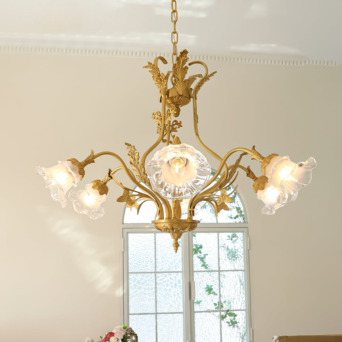 Dore Flower Chandelier hanging in a sophisticated dining room.