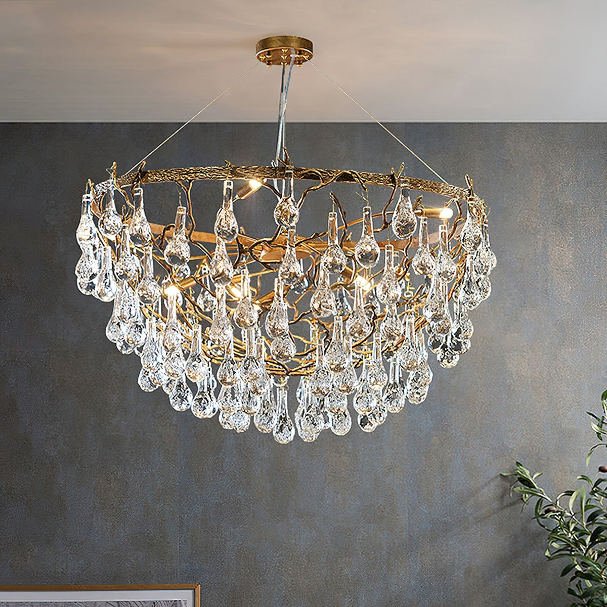 Close-up of the organic branch framework of the Doris Chandelier in antique brass.