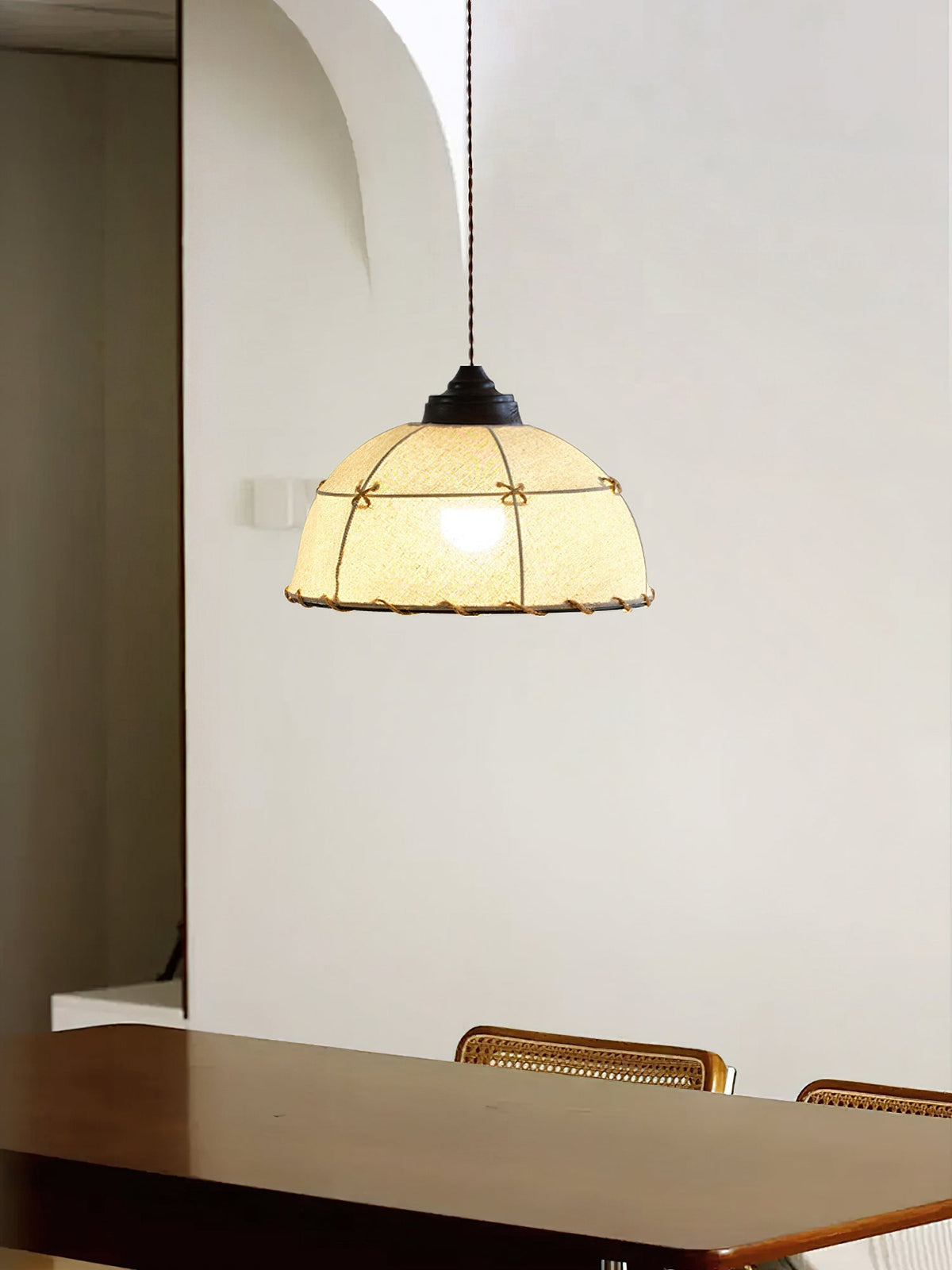 The single Duomo Pendant Light hanging over a modern dining table.