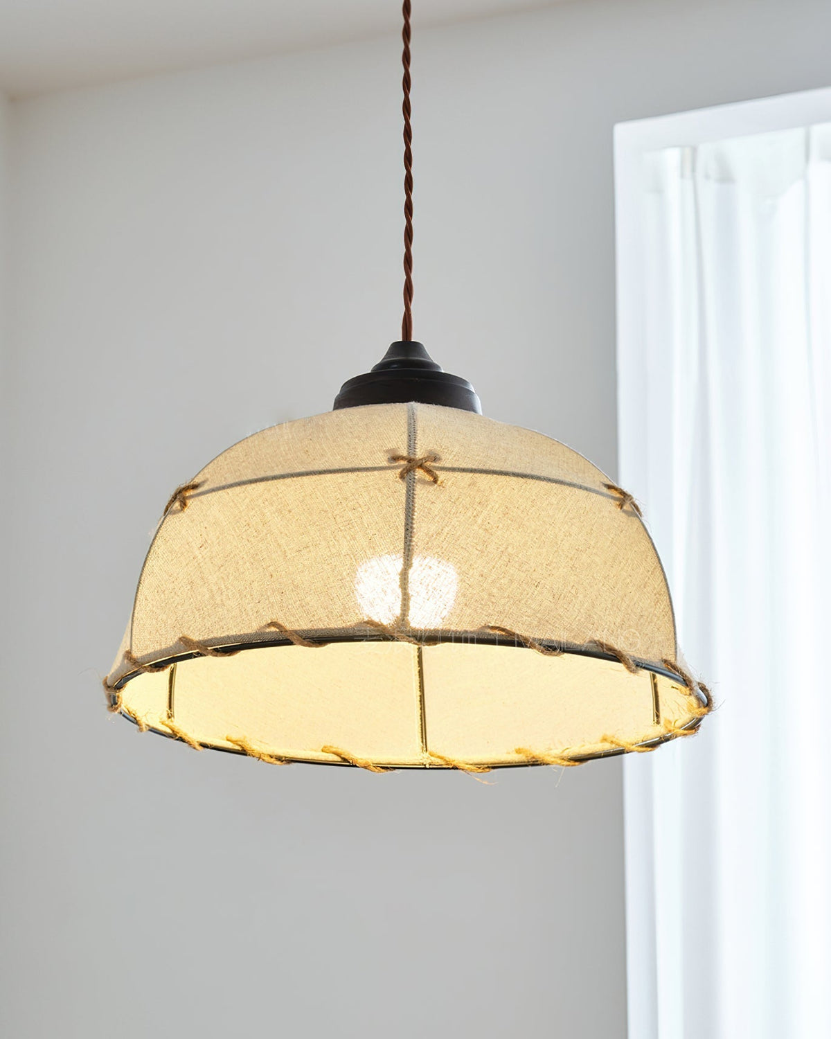 The three-light Duomo Pendant fixture in a spacious, contemporary room.