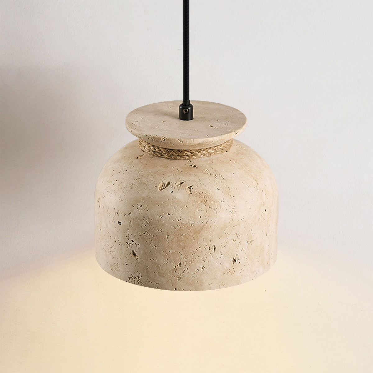 Close-up view of the Easton Pendant Lamp's travertine texture and wood detail.