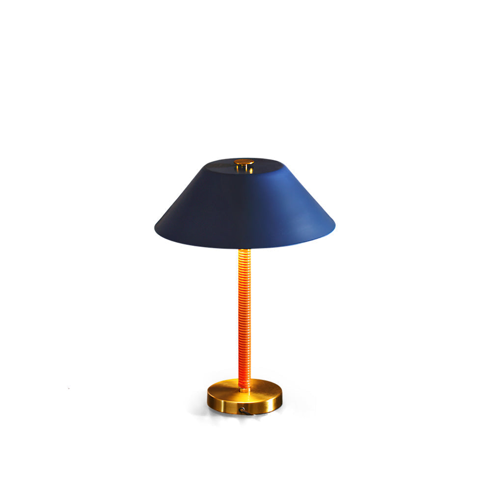 Eave Table Lamp in blue and gold finish on a plain background.