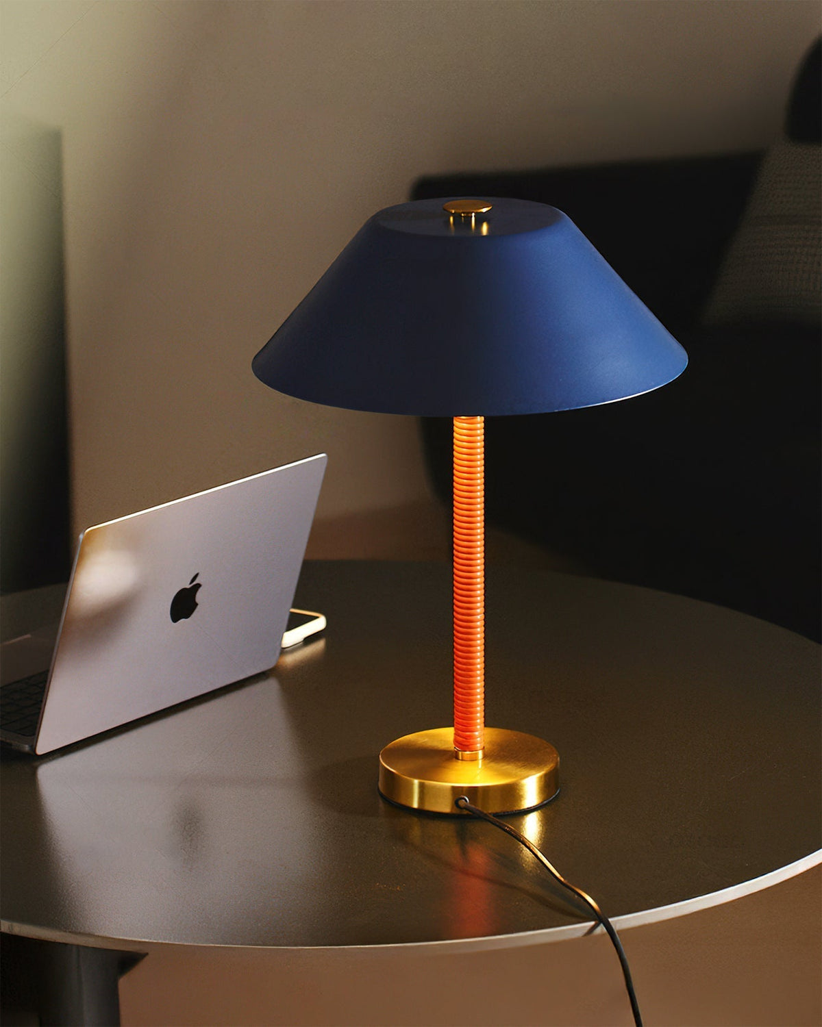 Angled view of the Eave Table Lamp, highlighting its architectural form.