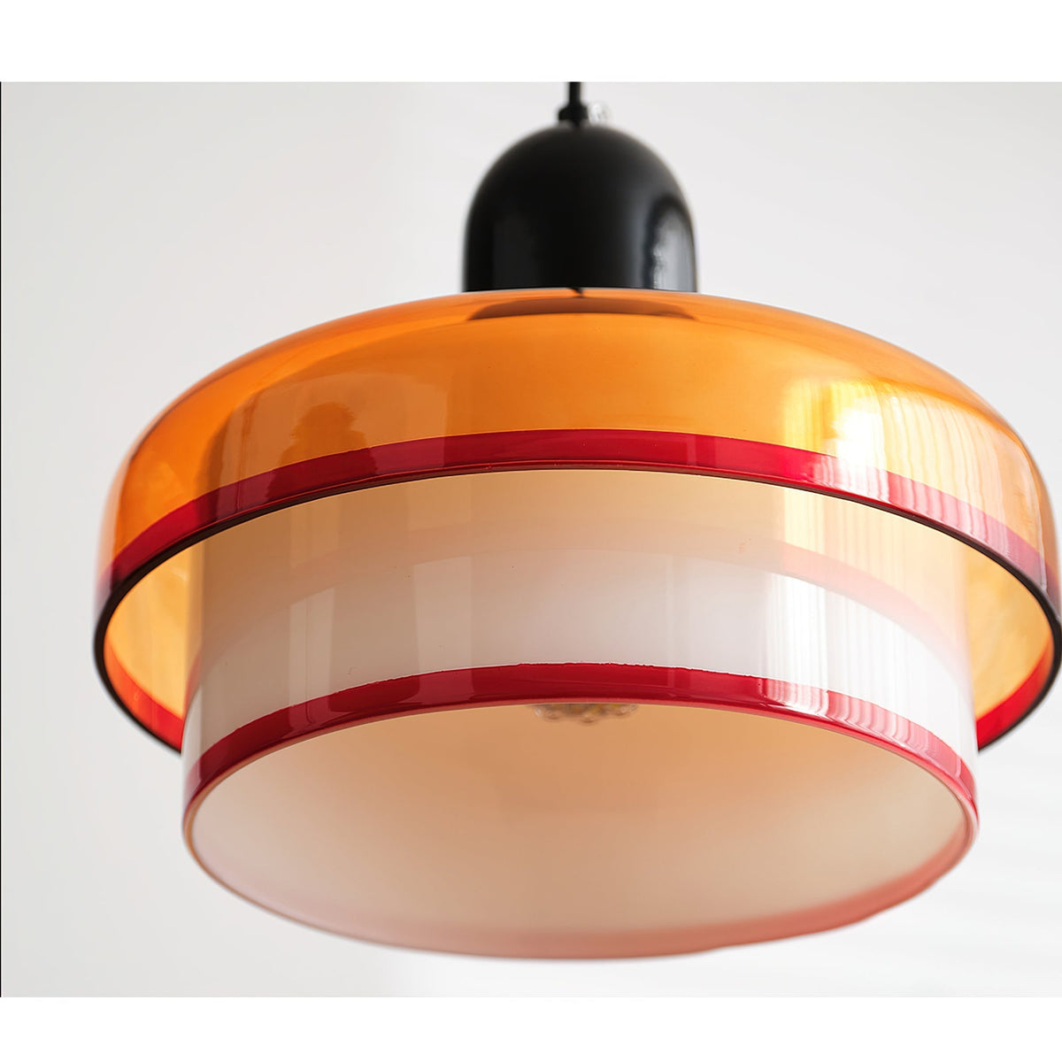 Lifestyle image featuring the Ebern Pendant Light in a living room.