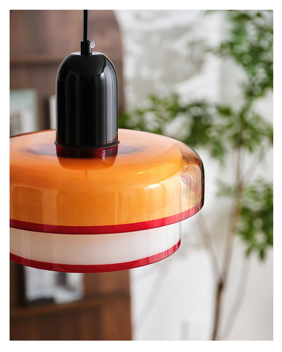 Ebern Pendant Light shown over a dining table.