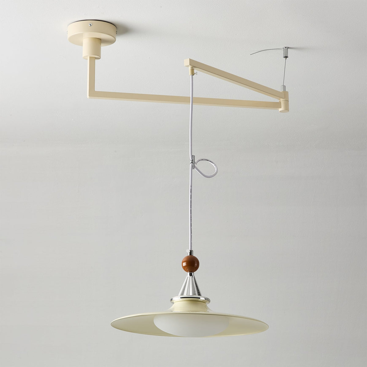 Lifestyle image of the Walnut and Green pendant light.