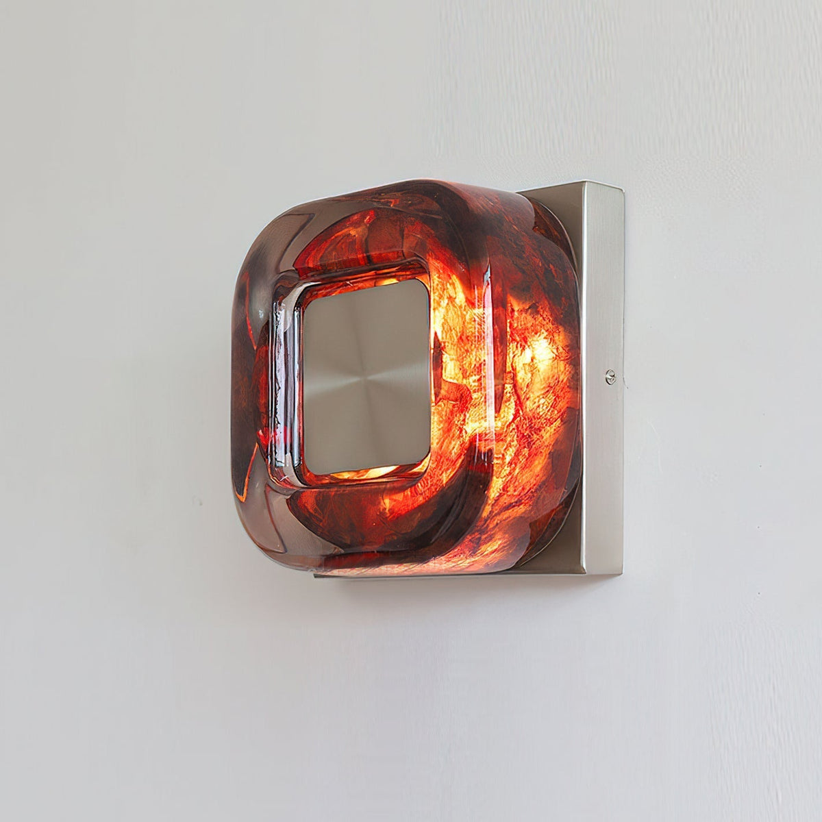 The circular silhouette of the Eisner Red Wall Sconce.