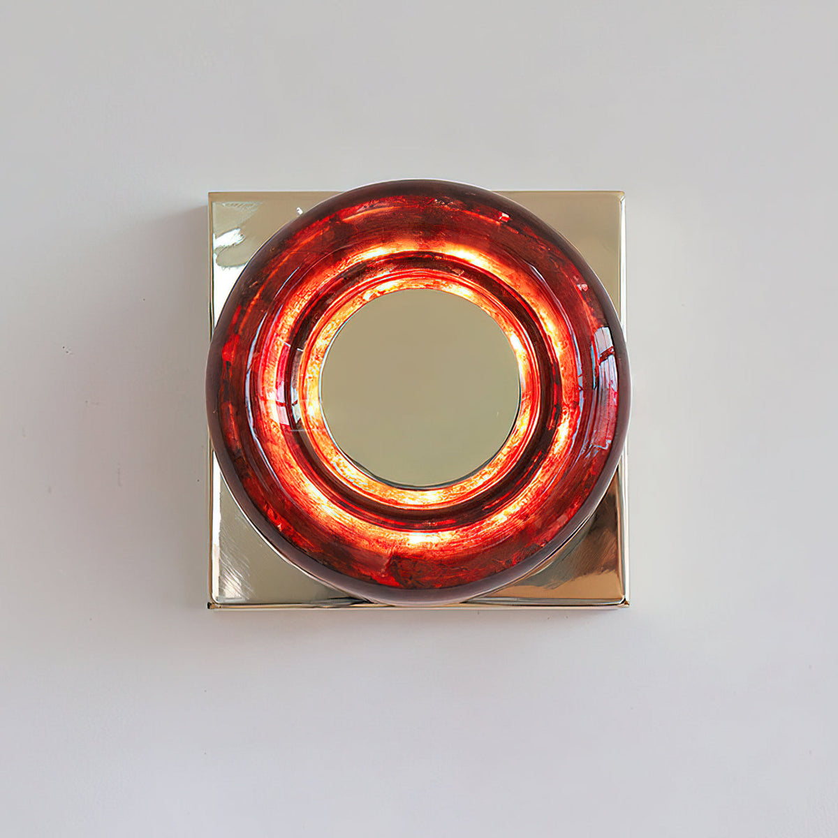 Eisner Red Wall Sconce against a light wall.