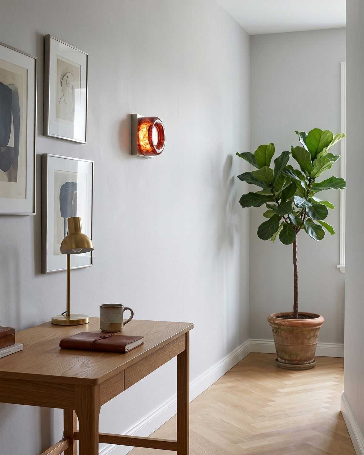 Eisner Red Wall Sconce against a dark wall.