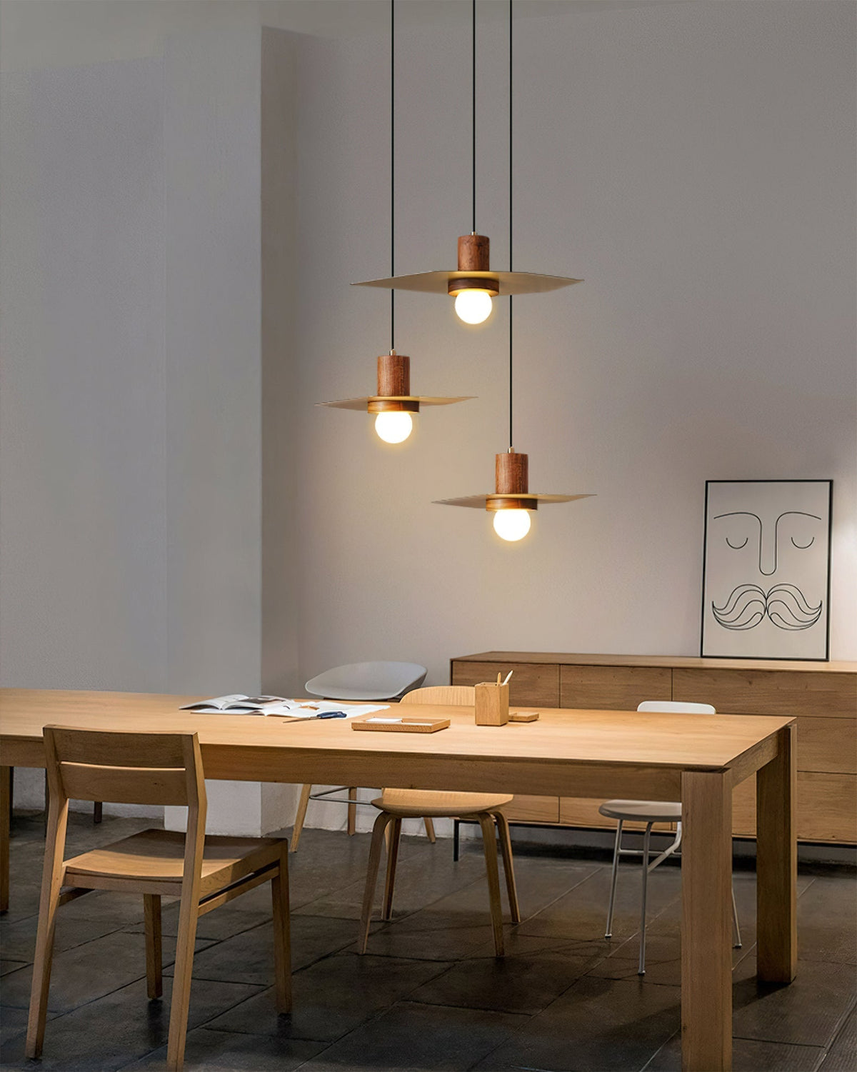 The Elara Pendant Lamp hanging in a modern, minimalist living room.