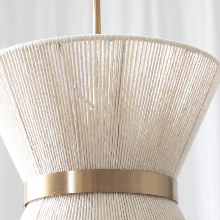 The large drum model of the Elara pendant light as a statement piece in a high-ceiling room.