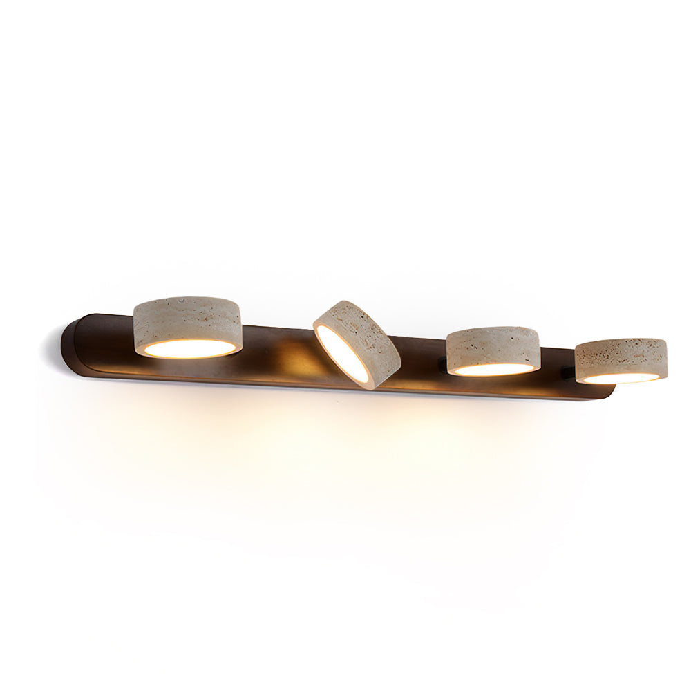 Elias Travertine Wall Lamp mounted on a plain wall, front view.