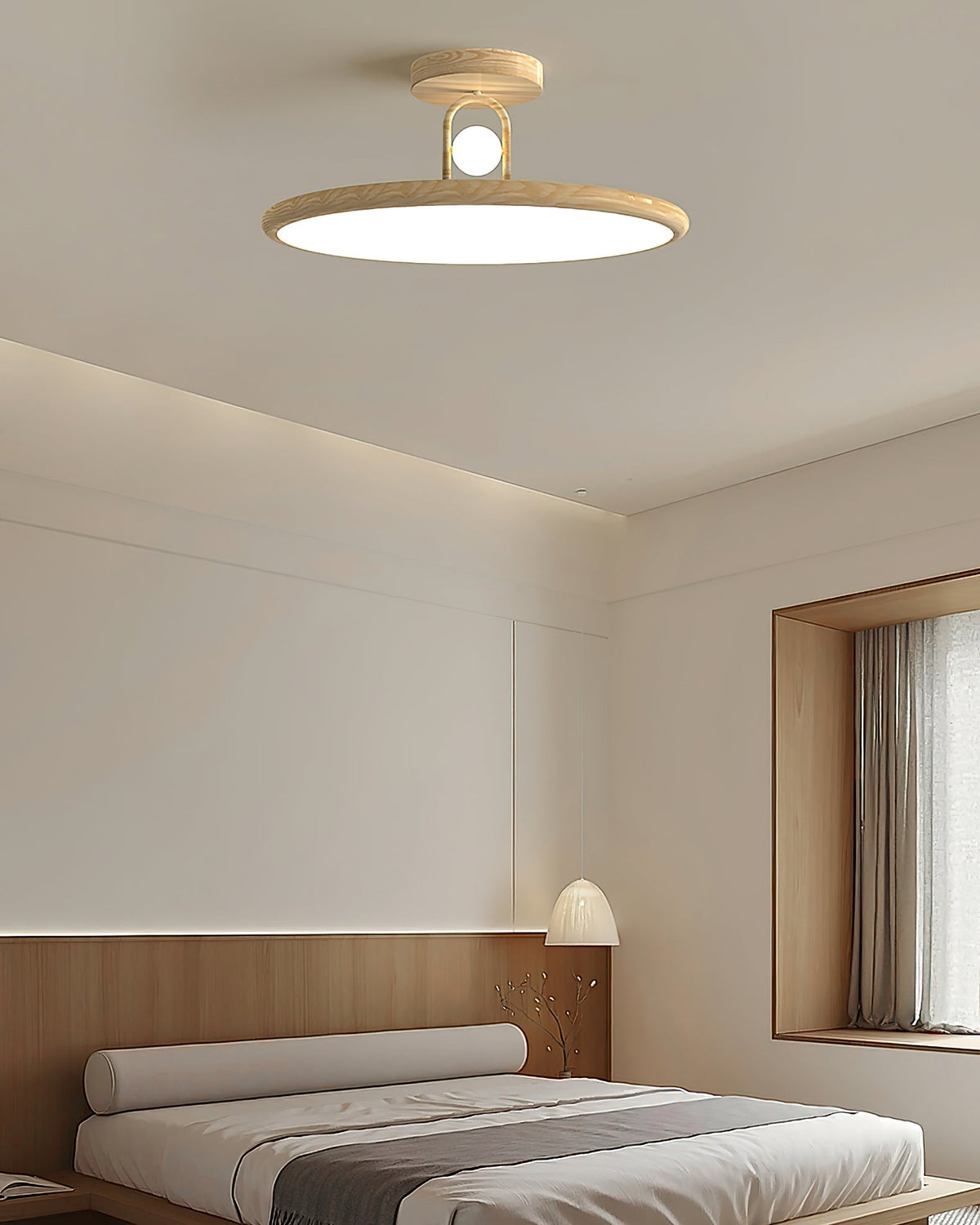Lifestyle image of the Envostar ceiling lamp in a minimalist bedroom.
