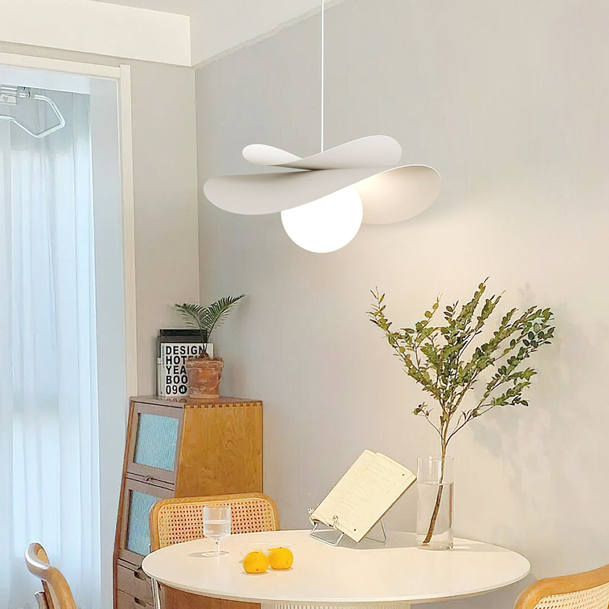 Detail shot of the ceiling mount and adjustable wire for the Fiksa Pendant Lamp.