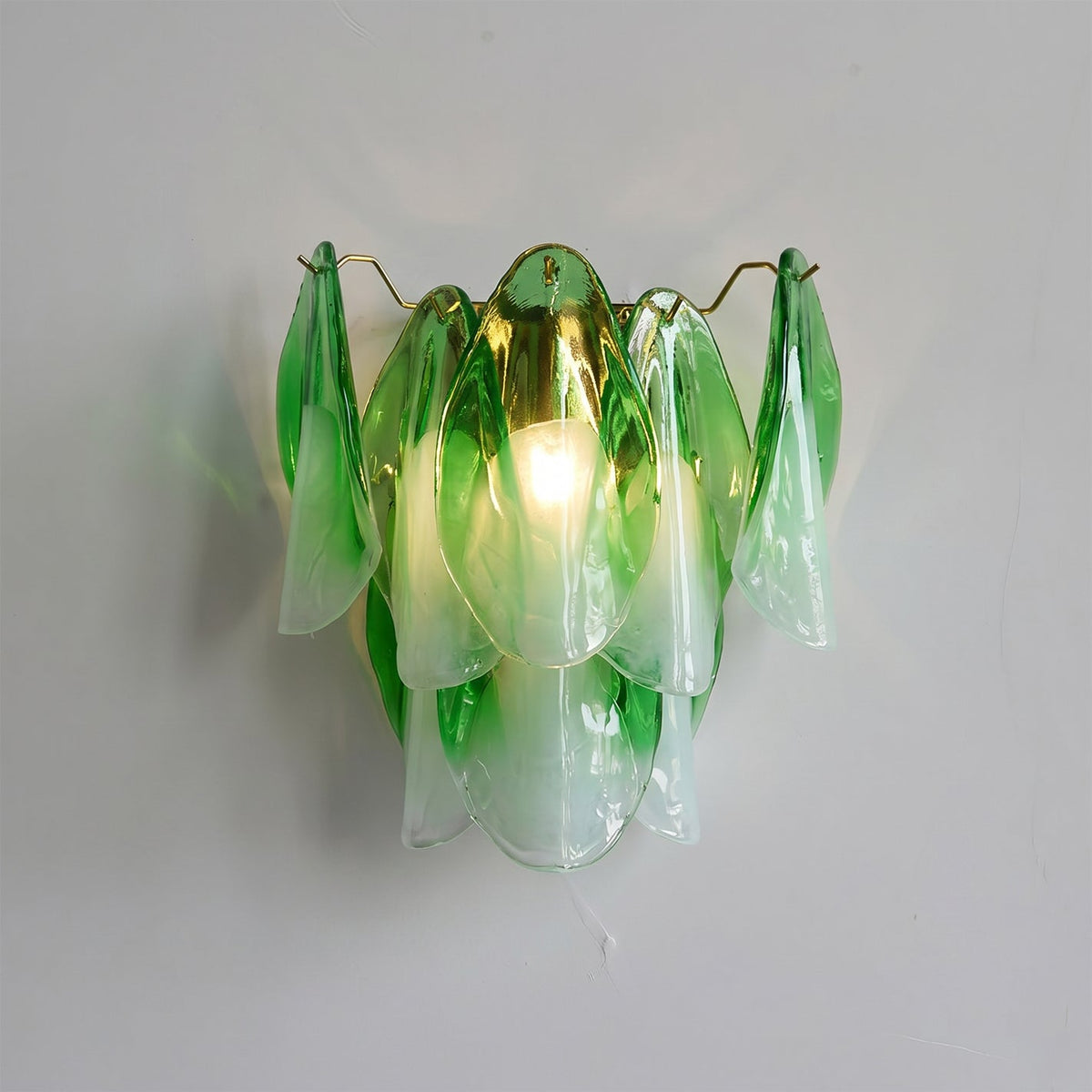 The white glass Foliage Wall Sconce in a bright, modern hallway.