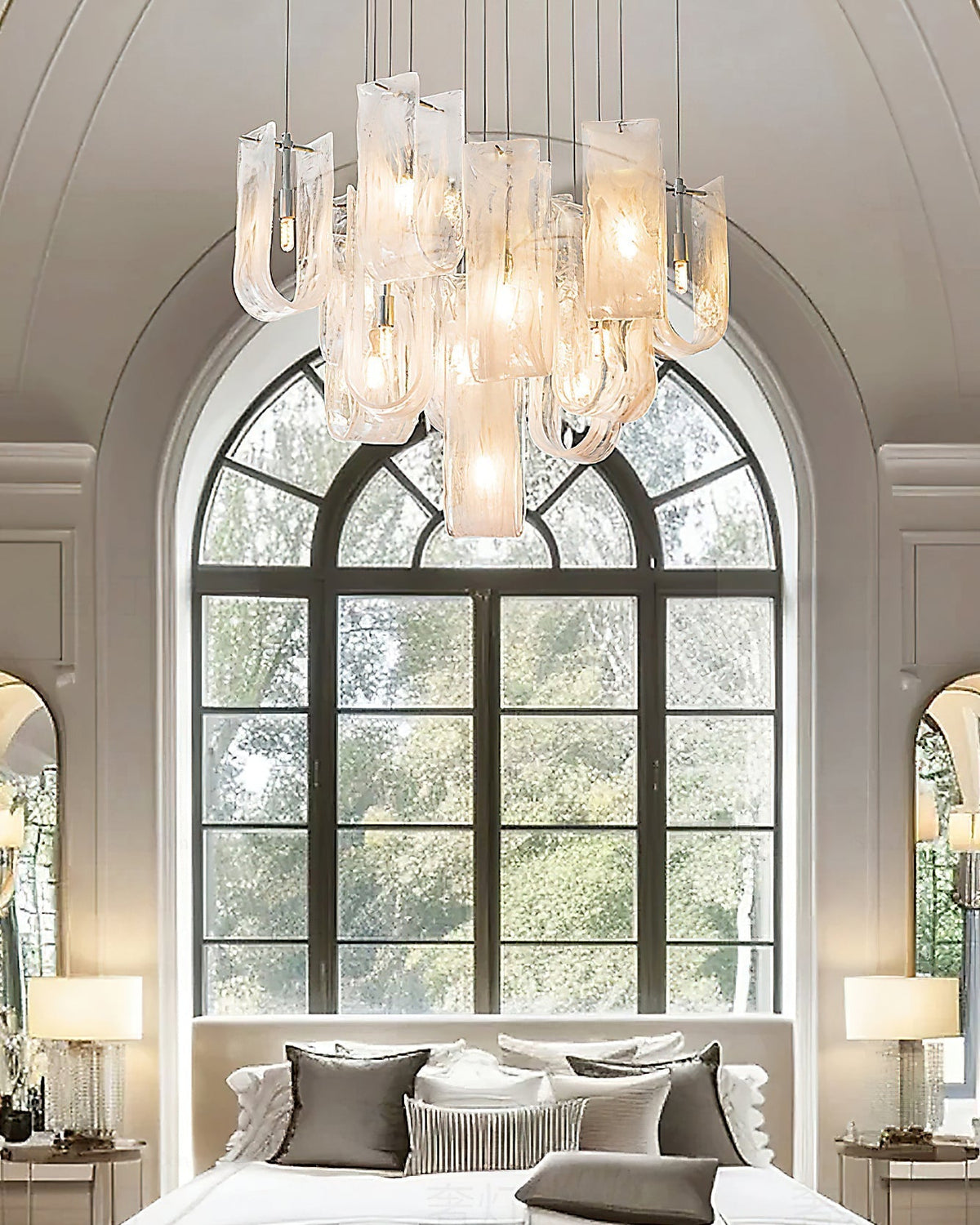 The chandelier illuminated at night, casting a warm and inviting glow.