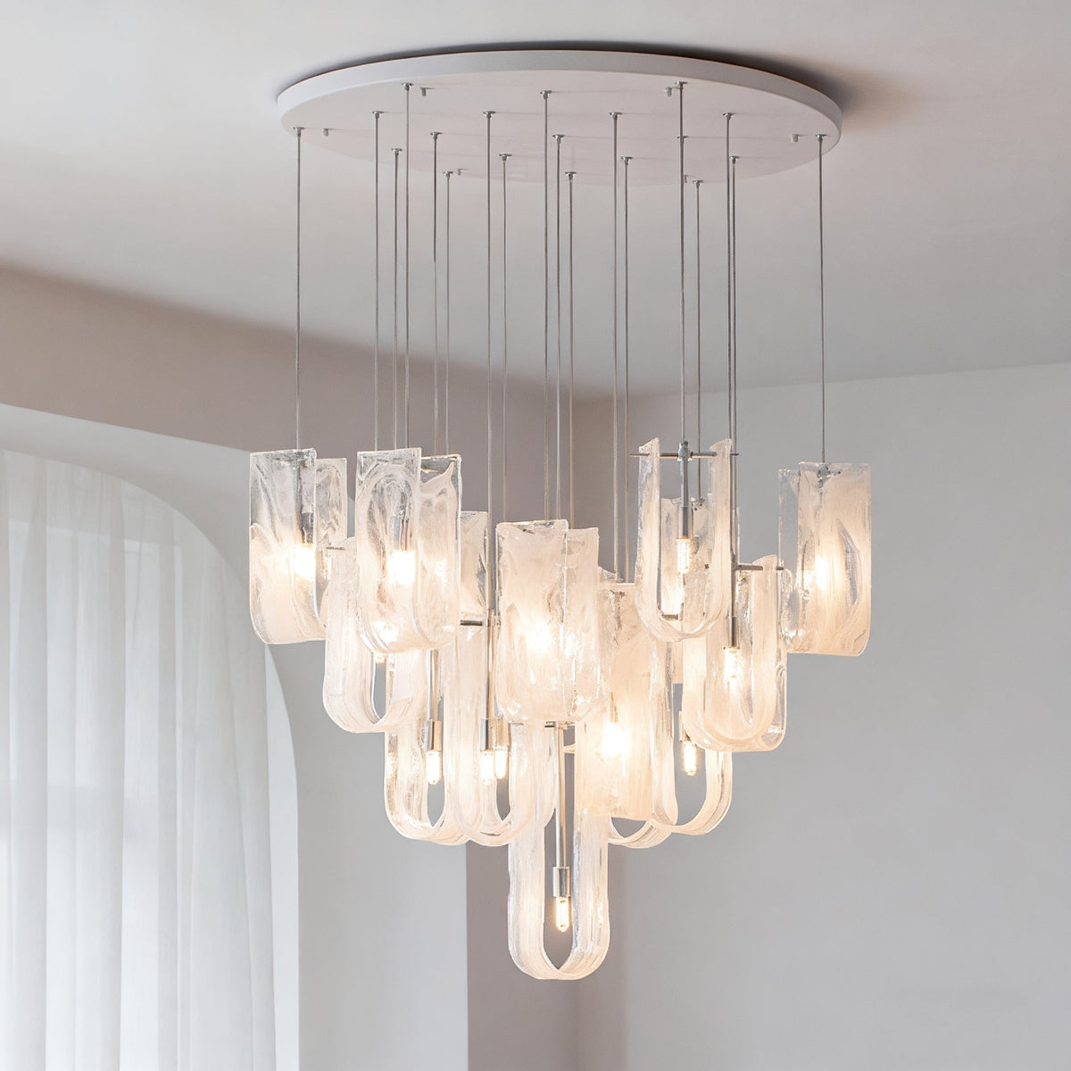 Close-up of the unique melting ice-like glass pendants on the Fontaine Chandelier.