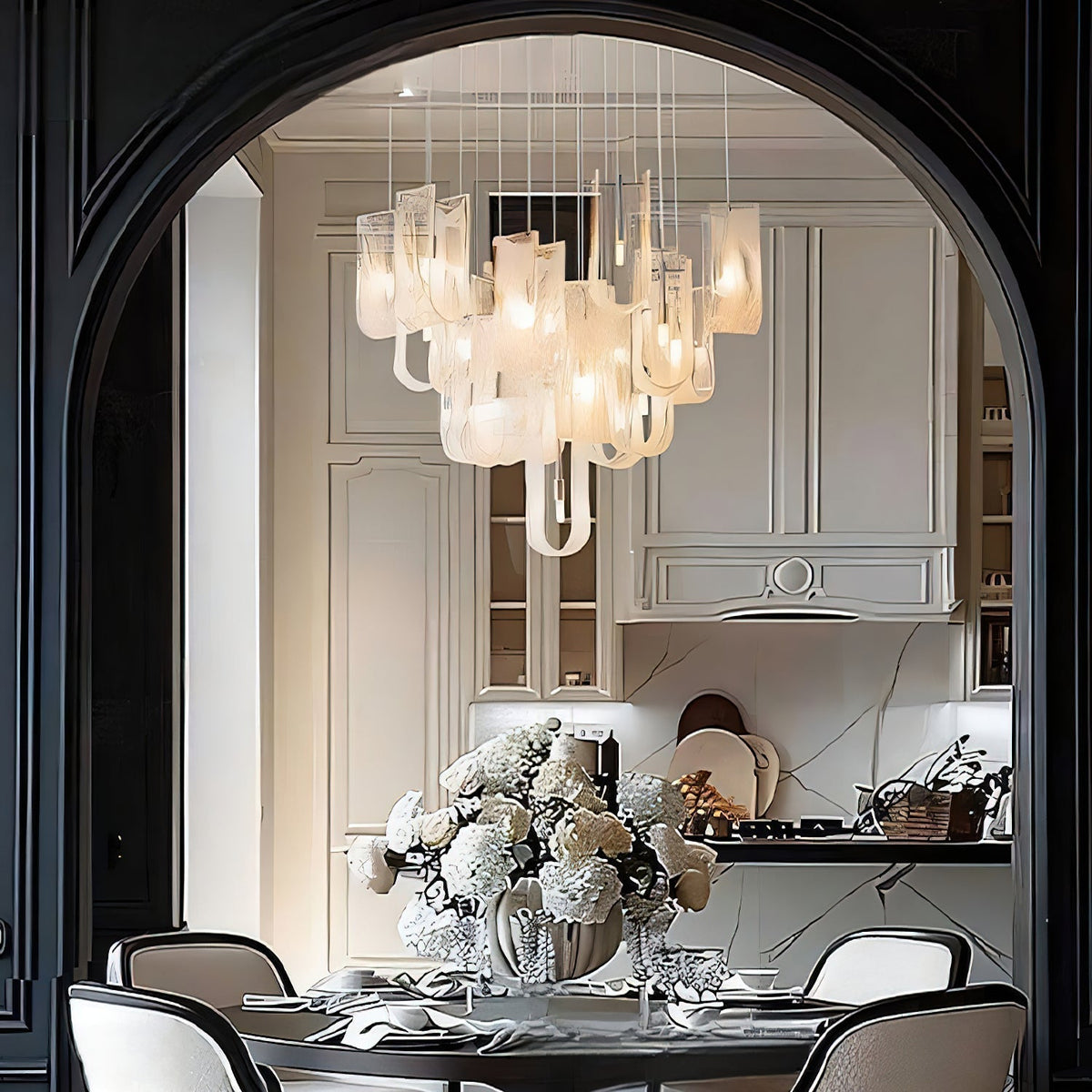 The Fontaine Chandelier hanging over a dining table as a statement piece.