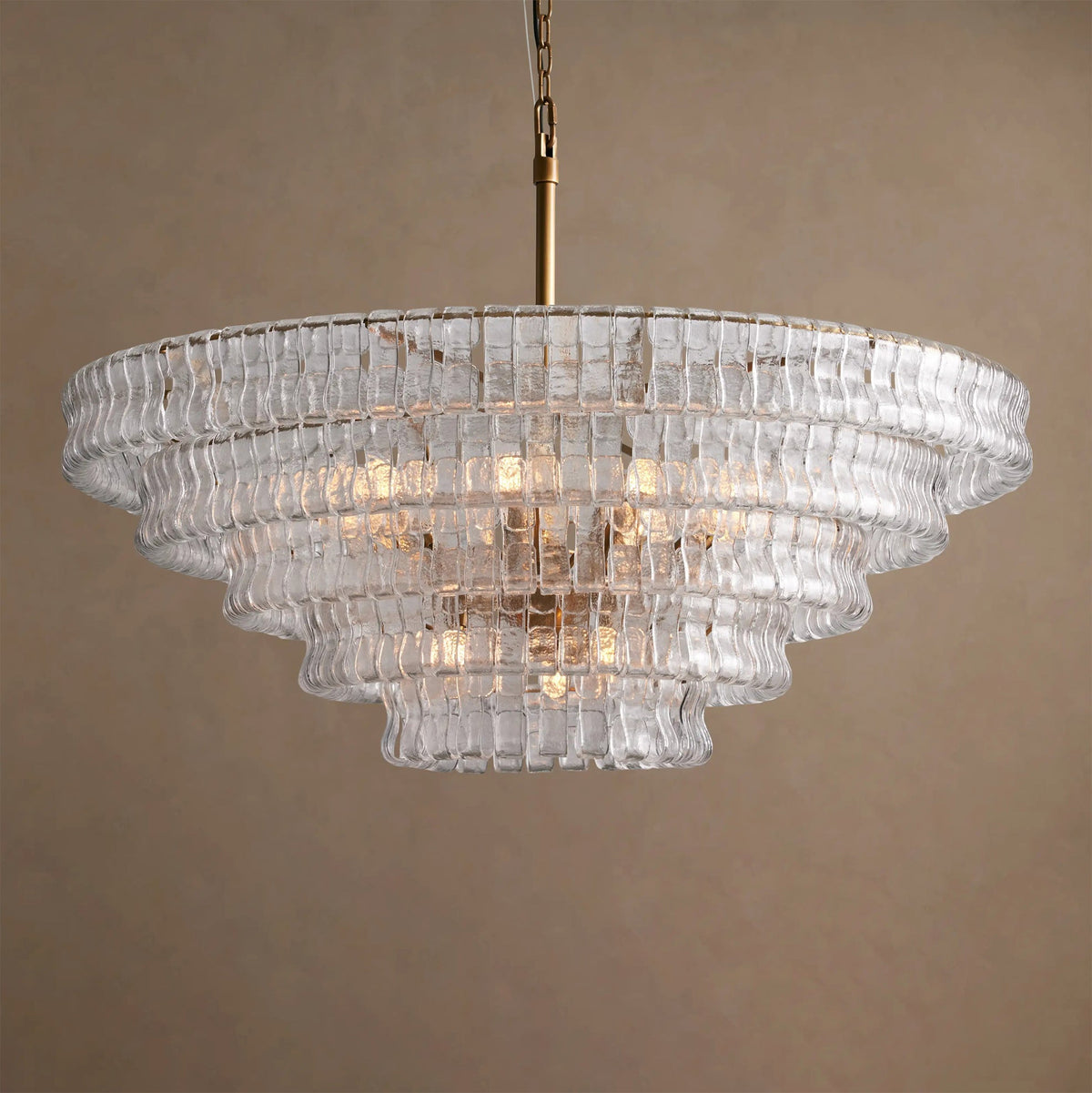 Ghiaccio Round Chandelier in Gold finish, viewed from the side.