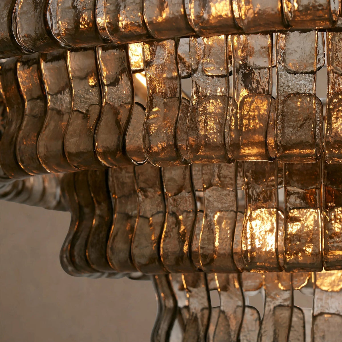 The large Ghiaccio Chandelier as a centerpiece in a great room.