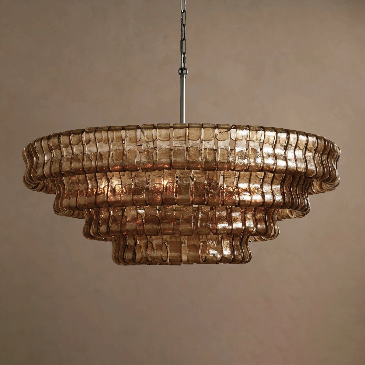 The warm, inviting glow from the Ghiaccio Chandelier with Amber glass.