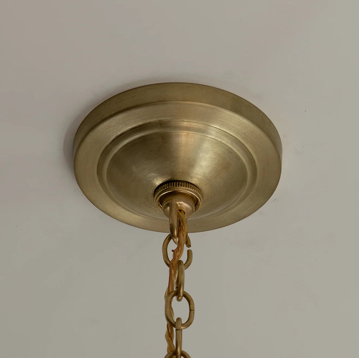 Lifestyle image of the Gideon Pendant Lamp in a decorated living space.