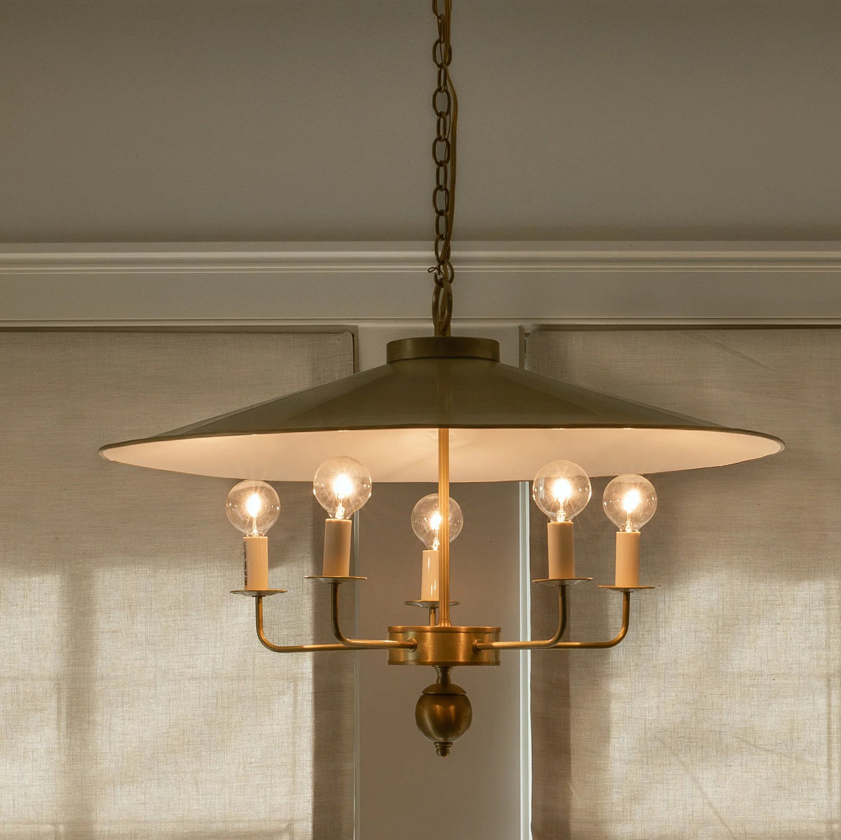 Close-up view of the Gideon Pendant Lamp's intricate brass structure.