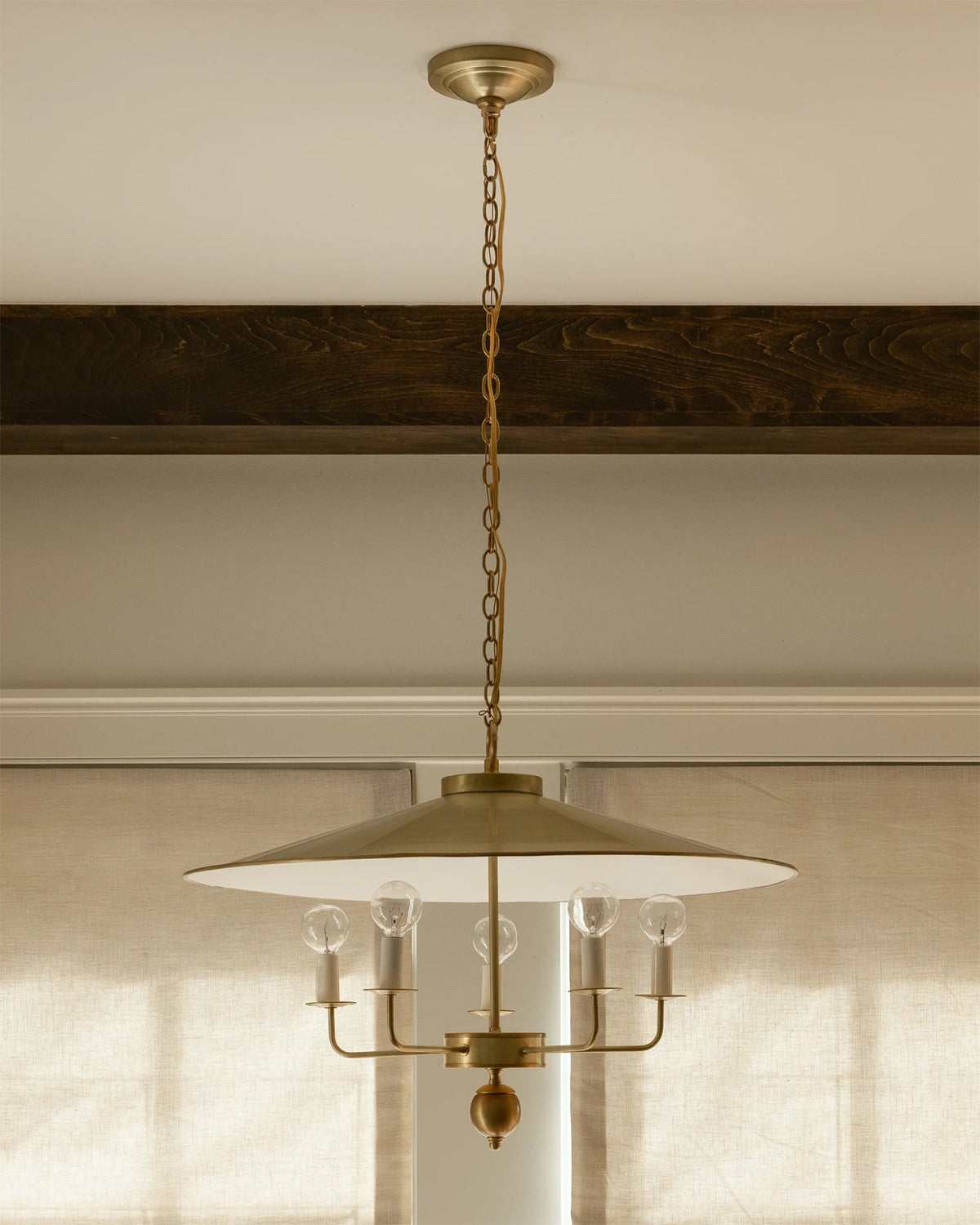 Gideon Pendant Lamp illuminated, casting a warm glow.