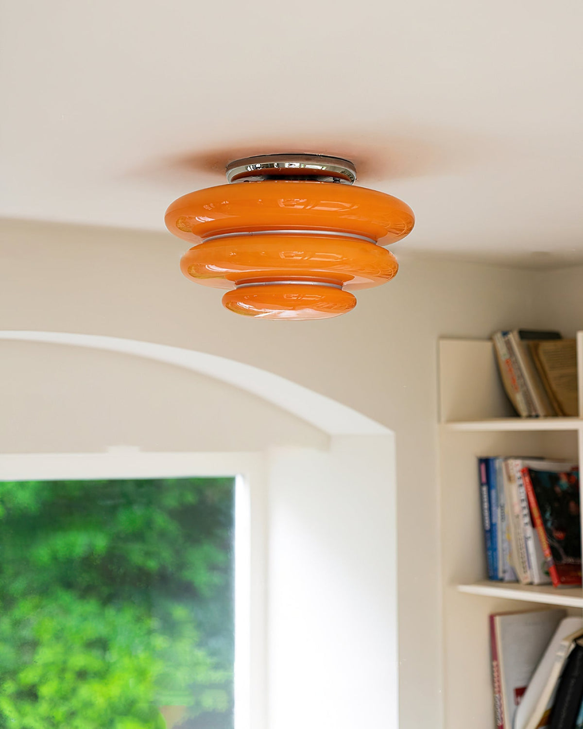 The Gispen Orange Ceiling Light installed in a modern living room setting.