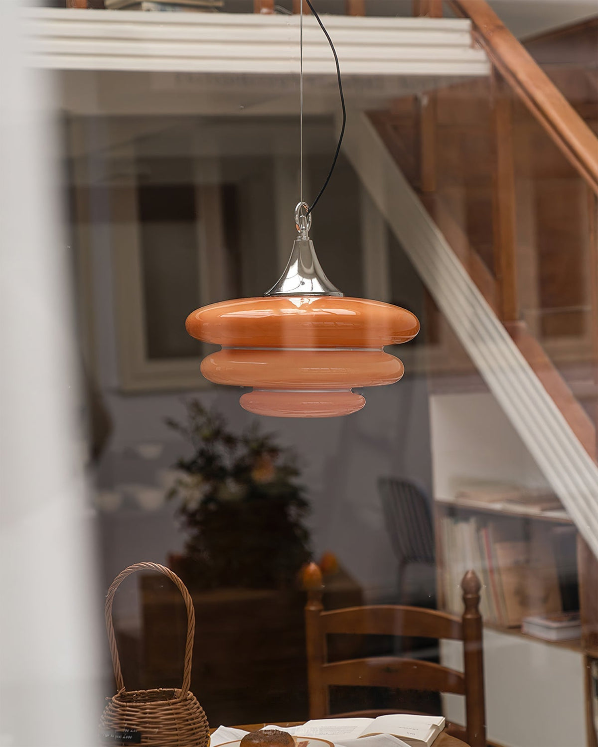 Bottom view of the Gispen Orange Pendant Light, showing the bulb fixture.