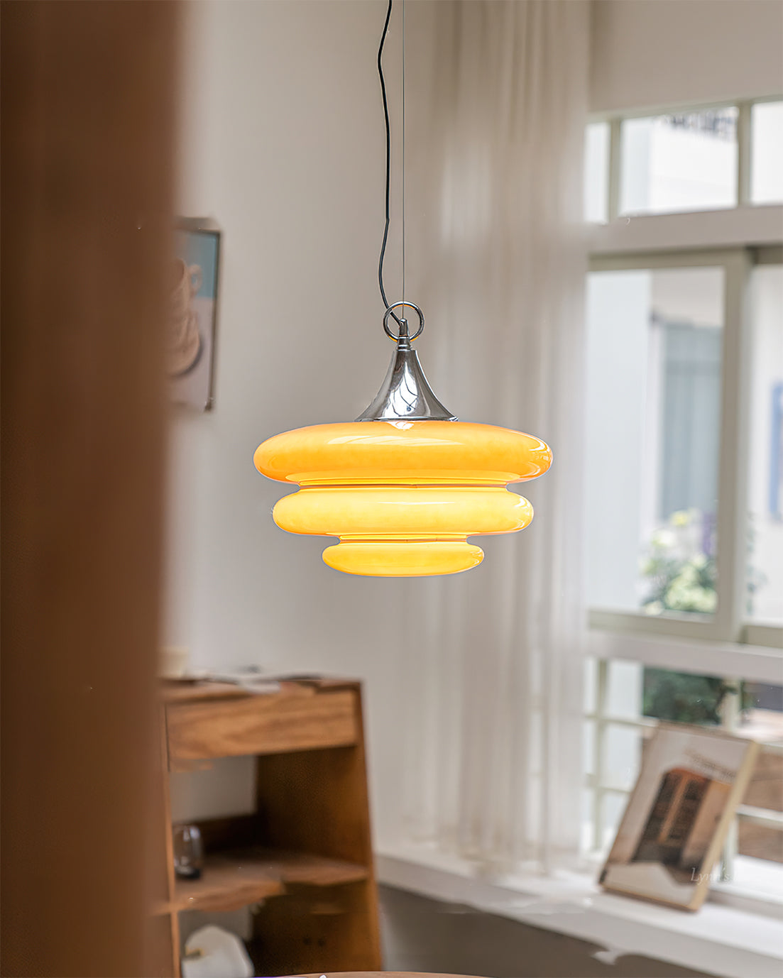 Side view of the Gispen Orange Pendant Light.