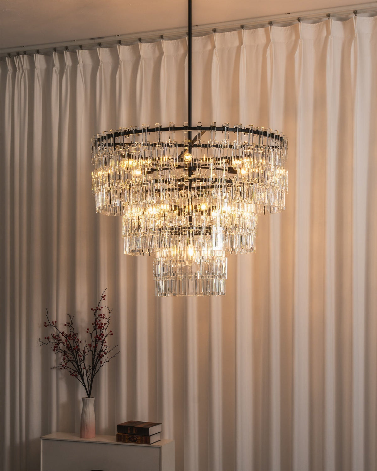 A wide shot of a foyer featuring the Harlow Chandelier.