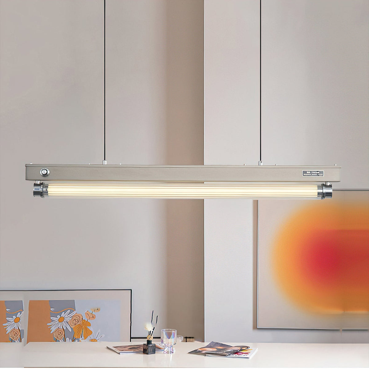 The black finish Hiromi Chandelier suspended in a minimalist living room.