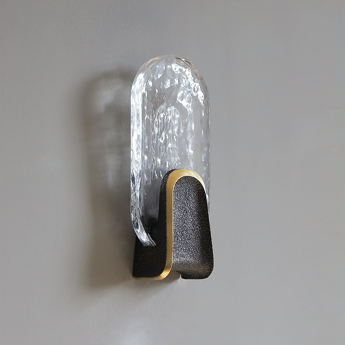 Ingot Wall Lamp featuring a smoky gray glass disc.
