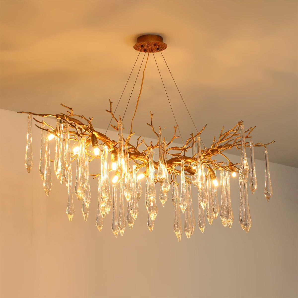 Detail shot of the G9 bulb socket within a glass shade of the Janae Chandelier.