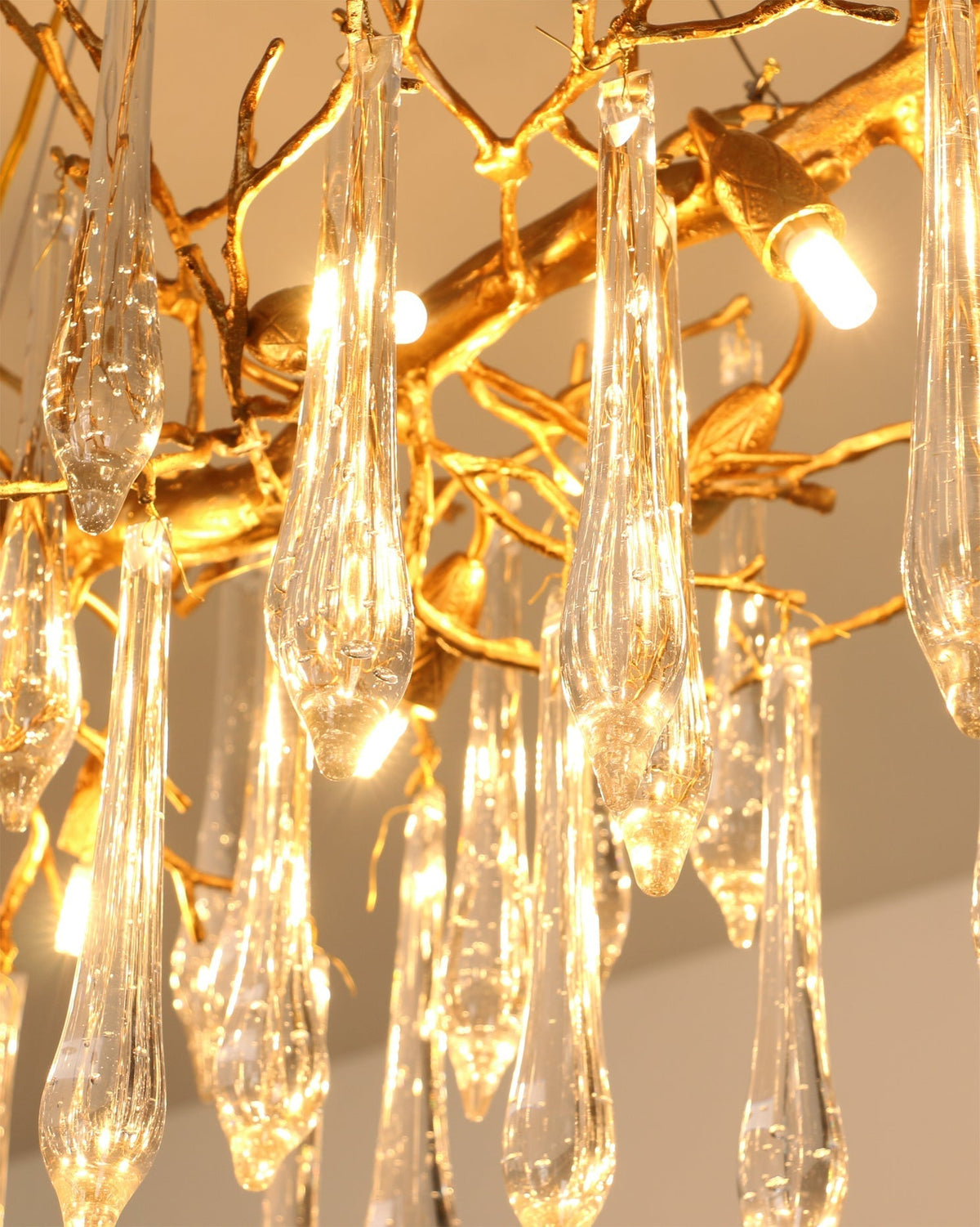 The Janae Chandelier installed over a dining table in a contemporary setting.
