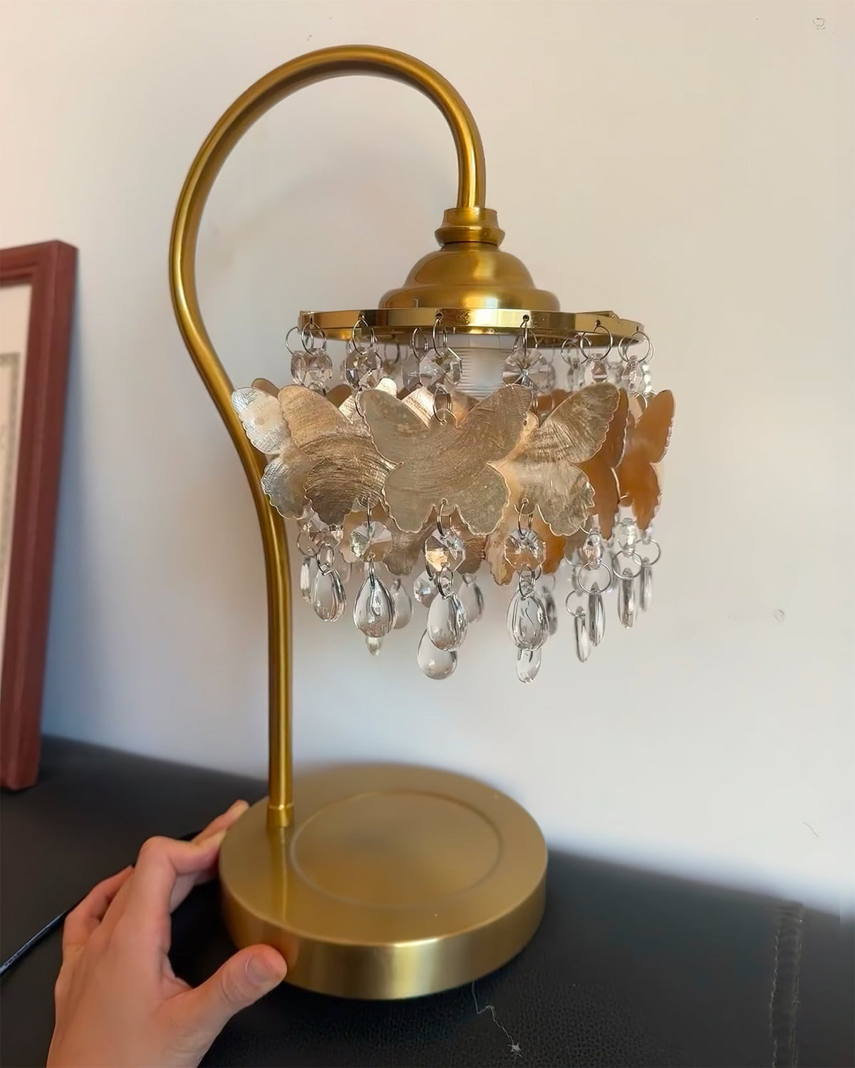 The Jasinski Table Lamp used as a decorative piece on a bedside table.