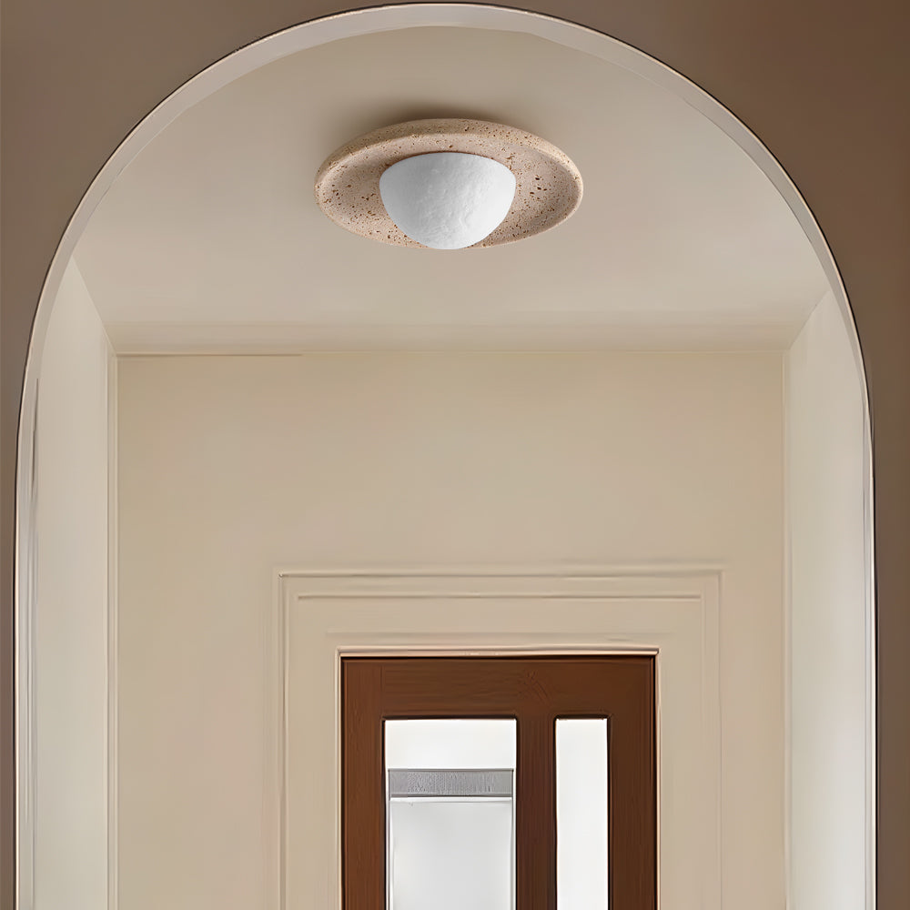 Close-up of the natural travertine texture on the Jenny Ceiling Light.
